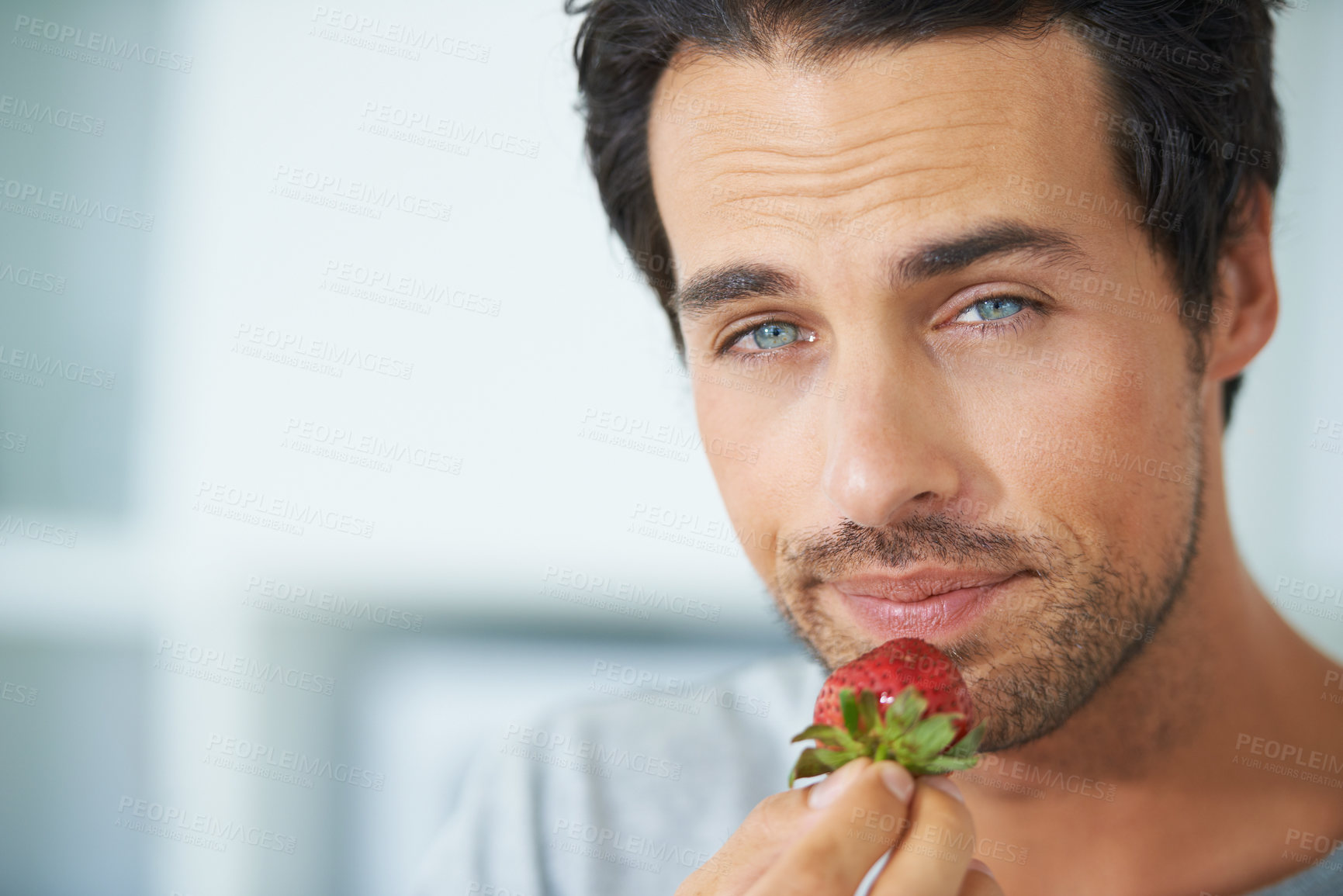 Buy stock photo Portrait, man and eating strawberry, healthy food or organic vegan product for weight loss benefits, wellness or breakfast. Vitamin C, headshot and face of male nutritionist with fruit nutrition meal