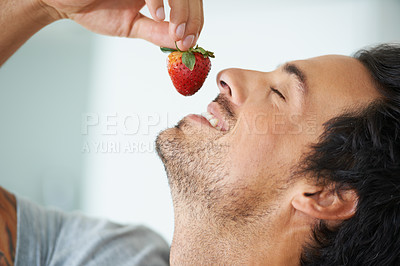 Buy stock photo Healthy food, relax man and eating strawberry for morning diet, organic vegan lifestyle or weight loss benefits, wellness or breakfast. Vitamin C, eyes closed and face of person enjoy fruit nutrition