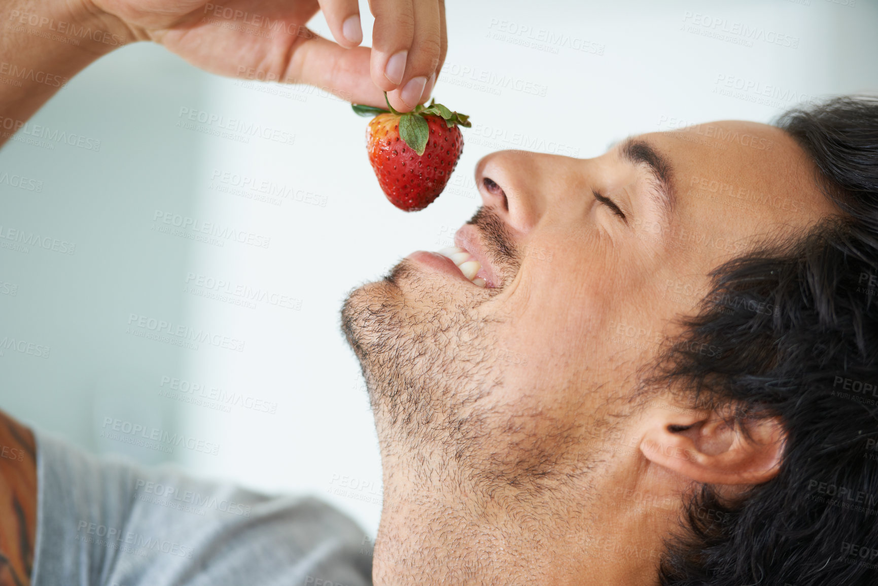 Buy stock photo Healthy food, relax man and eating strawberry for morning diet, organic vegan lifestyle or weight loss benefits, wellness or breakfast. Vitamin C, eyes closed and face of person enjoy fruit nutrition