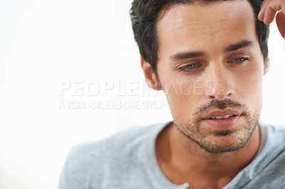 Buy stock photo Man, thinking and depressed with mental health or serious or sad and isolated on white background. Closeup, male person face contemplating and worried or in thought and feeling stress alone in studio