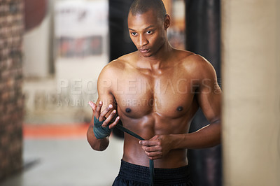 Buy stock photo Fighting, gym and black man wrapping hands with fitness, power and training challenge. Strong body, muscle workout and boxer in gym, athlete with confidence and getting ready for boxing competition.