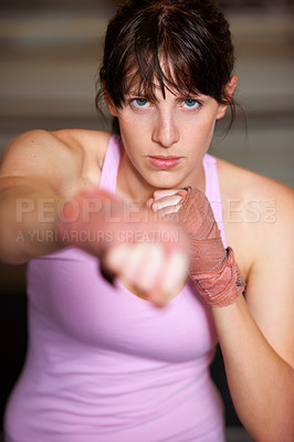 Buy stock photo Boxing, punch and portrait of woman with fitness, power and fearless training challenge in gym. Strong body, muscle and face of boxer, athlete or girl with fist up for confidence in competition fight
