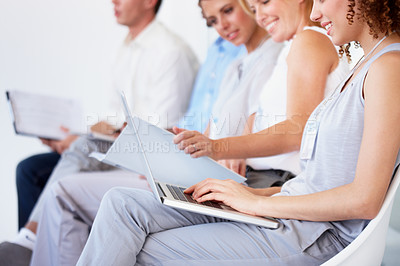 Buy stock photo Waiting room, laptop and business people for recruitment information, job search or human resources opportunity. Professional woman in chair typing on computer, resume update or CV for online hiring