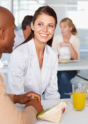 Buy stock photo Business people, friends and discussion at lunch table in corporate office together. Coworking, man and woman on break, eating food and happy team in communication, meeting and listen to conversation