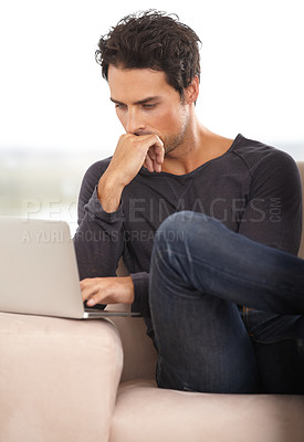 Buy stock photo Man, work from home and thinking on laptop for stock market investment, reading information or website on sofa. Freelancer or trader on his computer with trading software, choice or online decision