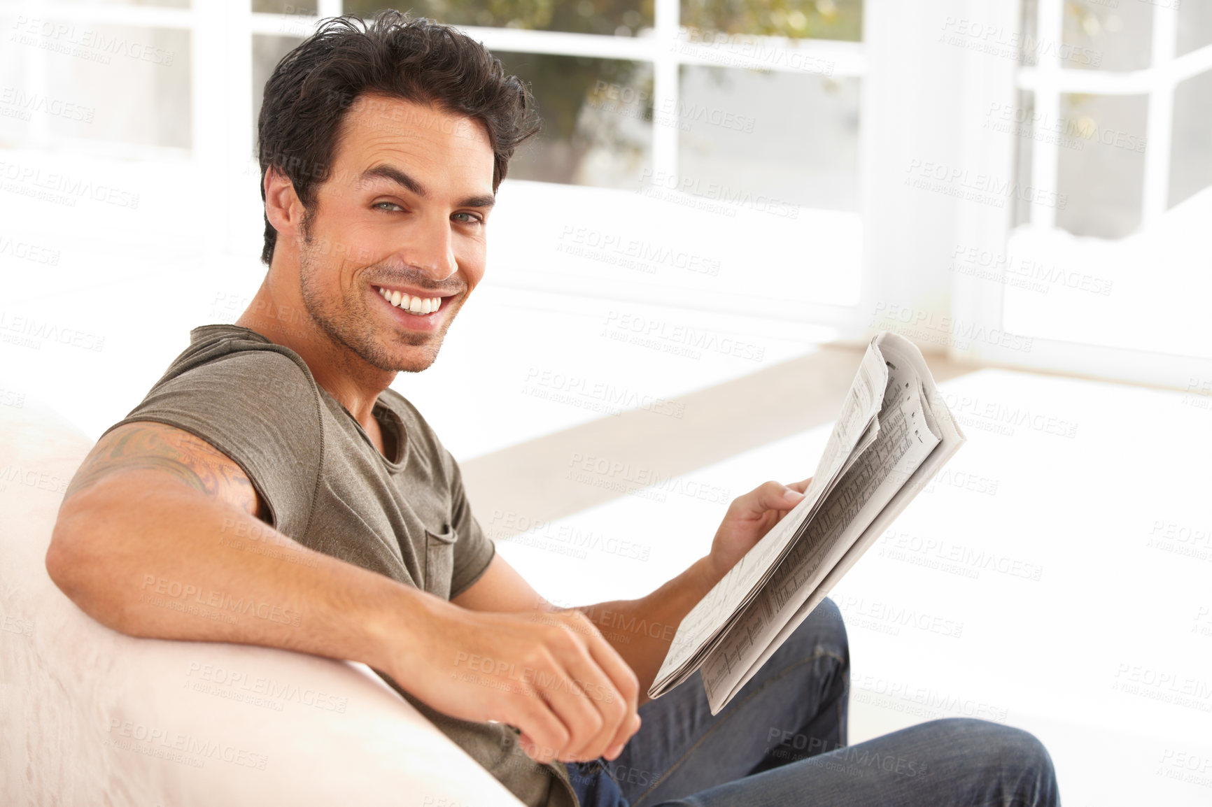 Buy stock photo man, portrait and happy with newspaper on sofa for relax, morning break and information in living room. Person, face and smile for article, story and news on couch of apartment for reading or peace  