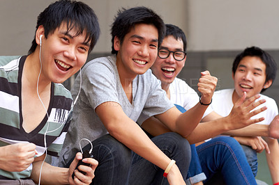 Buy stock photo Asian men, students and outdoor celebration for success, goal or sports with smile, happiness and fist. Japanese student group, celebrate or friends for winning, achievement or sport event at campus
