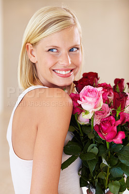 Buy stock photo Woman, rose bouquet and smile with face, beauty and arrangement with studio background, happy and gift. Look, female model and flowers for love, present and valentines day with romantic gesture
