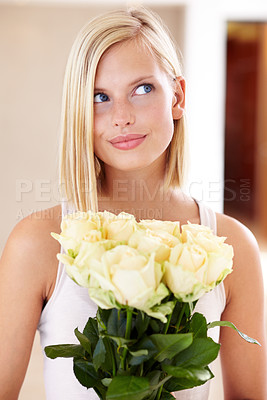 Buy stock photo Woman, rose bouquet and eyes with face, holding and floral arrangement in house, confident and gift. Look, female model and flowers for love, present and valentines day with romantic gesture
