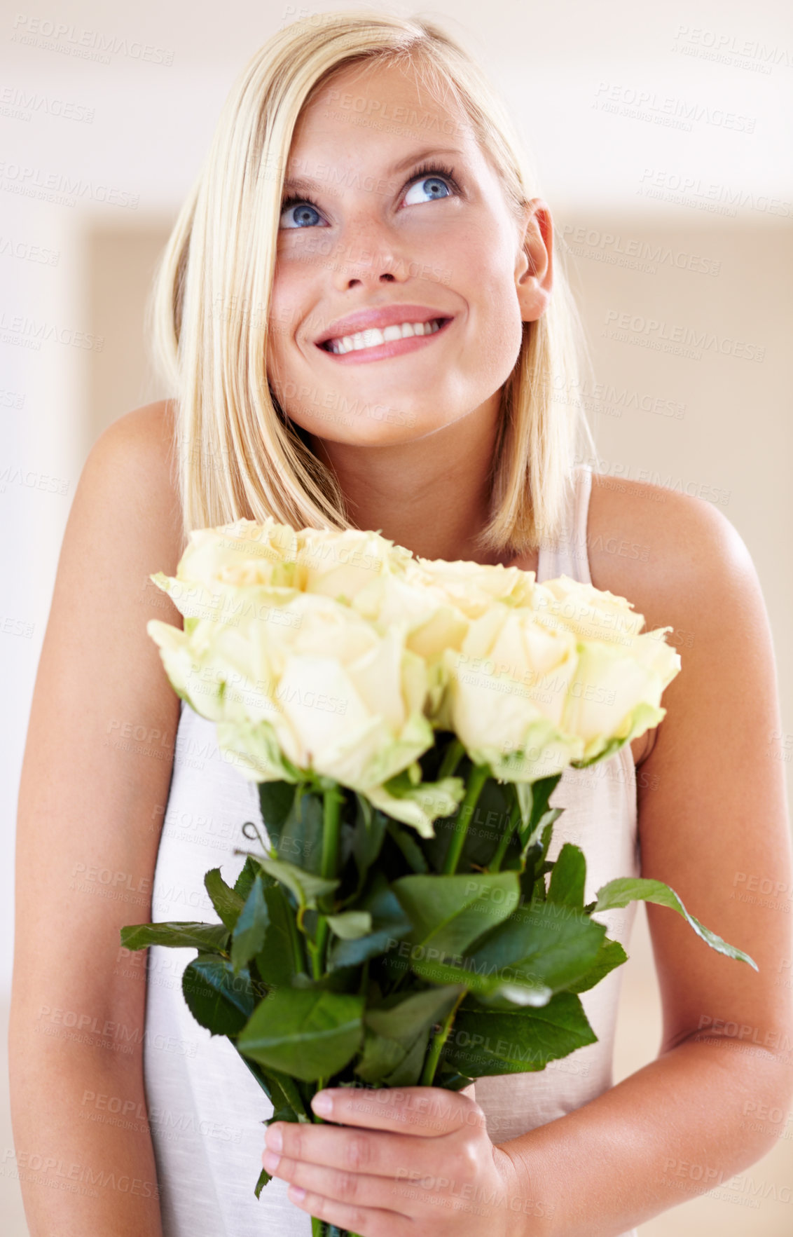 Buy stock photo A young woman holding a bunch of roses