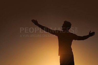 Buy stock photo Silhouette of a man with his arms outstretched - copyspace
