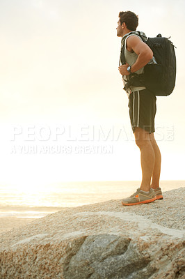 Buy stock photo Man, backpack or rock and cliff in nature for travel, adventure or scenery with sunshine, thinking or view. Person, mountain or sky for holiday, vacation or experience outdoor and freedom or trekking