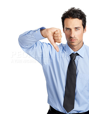 Buy stock photo Hand, thumbs down and portrait of businessman in studio for no, bad and business fail on white background. Face, failure and young entrepreneur showing negative emoji for objection while isolated