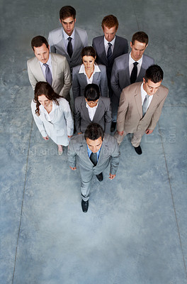 Buy stock photo Top view, serious team or business people in office, cooperation or collaboration solidarity on mockup space. Above, group or professional corporate employee, lawyer or leadership at company together