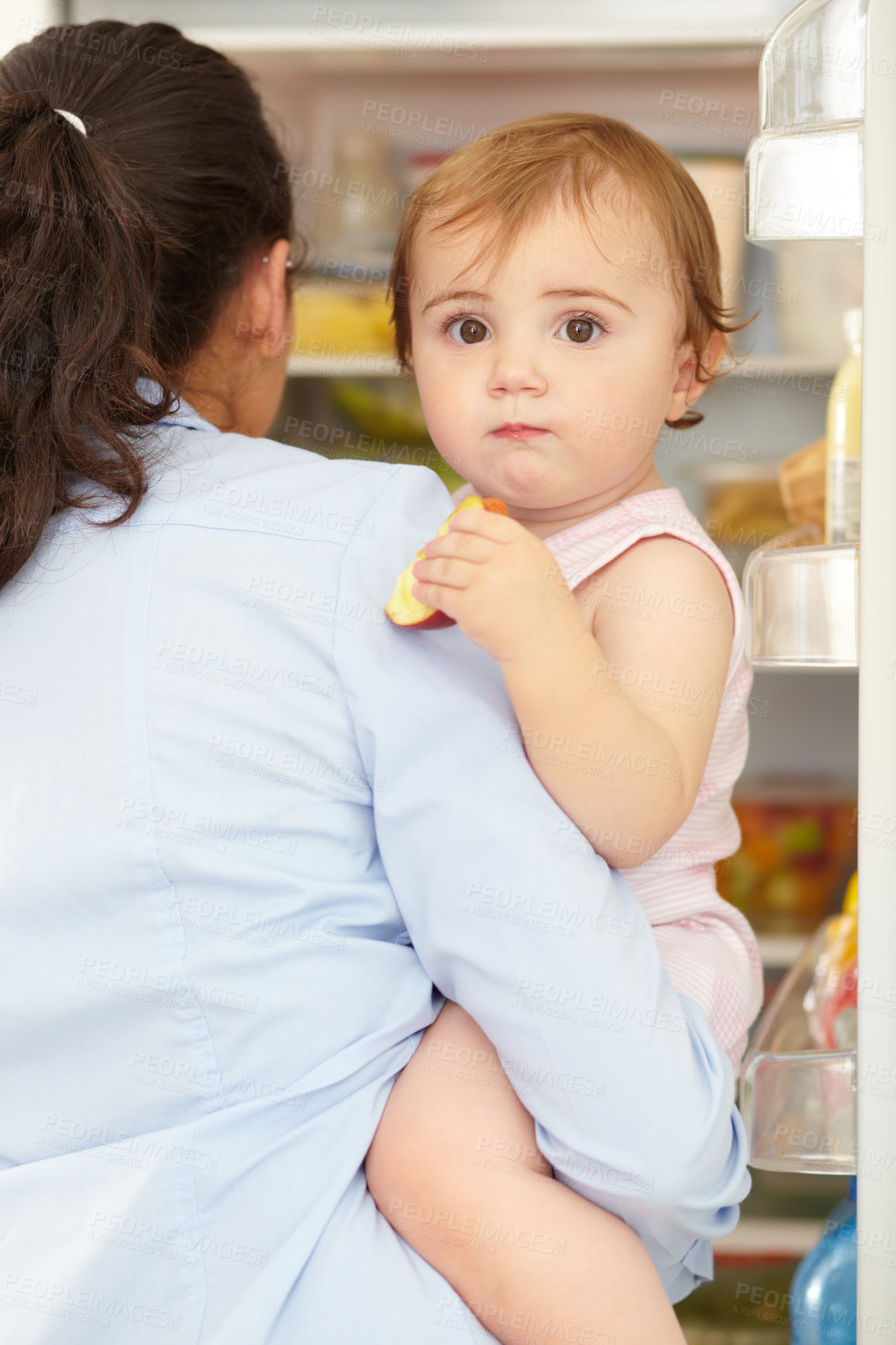 Buy stock photo Portrait, woman and fruit of toddler in kitchen, open fridge and food for hunger in back view. Youth, little girl and hold snack for eating for nutrition in healthy vegan, vegetarian or diet in home