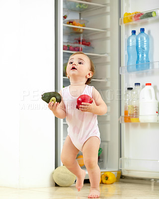 Buy stock photo Toddler, little girl and food from fridge in kitchen for running with fresh, fruit and vegetable in hand. Youth, child and curious for organic, natural and nutrition for development of motor skill