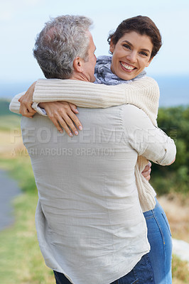 Buy stock photo Couple, face and laughing in nature with hug for romance, love and relationship outdoor with date. Mature, man and woman or embrace with happy, playful and trust for bonding, honeymoon and support 