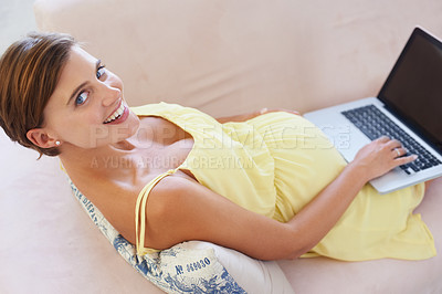 Buy stock photo Top view, pregnant and portrait of woman on laptop for childcare, information or birth learning in house living room. Smile, happy or relax person on home sofa technology, research or pregnancy blog