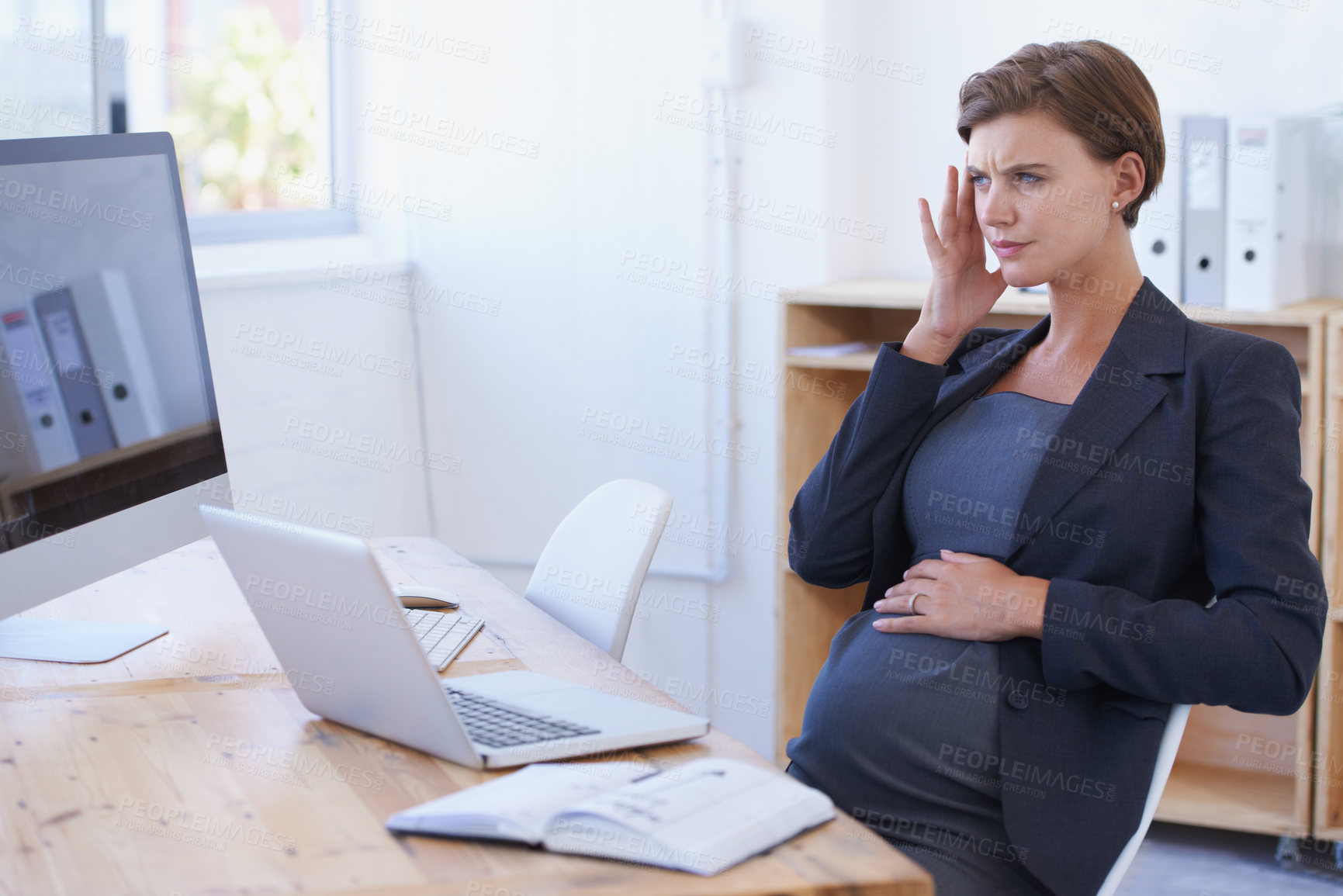 Buy stock photo Business woman, pregnant and headache in stress, anxiety or mental health with laptop at office. Female person or employee with migraine in maternity, pregnancy or under pressure by desk at workplace