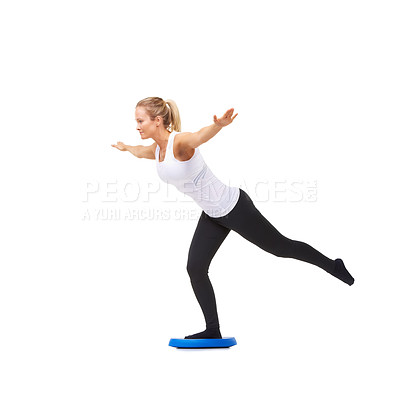 Buy stock photo Balance, workout and fitness with woman on disk in studio for health, mindfulness or exercise. Wellness, challenge and training with person on white background for flexibility, smile or aerobics