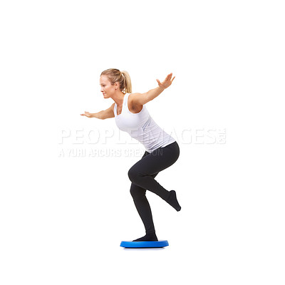 Buy stock photo Balance, exercise and fitness with woman on disk in studio for workout, mindfulness or health. Wellness, challenge and training with person on white background for flexibility, smile or aerobics