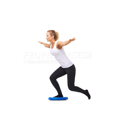 Buy stock photo Balance, health and training with woman on disk in studio for workout, body or exercise. Wellness, challenge and fitness with female person on white background for flexibility, active or aerobics