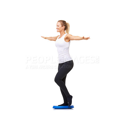 Buy stock photo Balance, health and fitness with woman on disk in studio for workout, mindfulness or exercise. Wellness, challenge and training with person on white background for flexibility, smile or aerobics