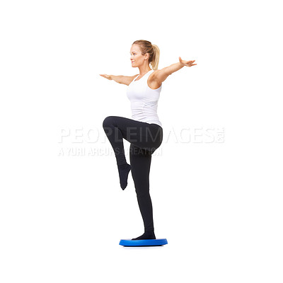 Buy stock photo Full length studio shot of a beautiful young woman doing balance exercises isolated on white