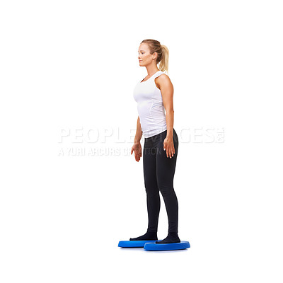 Buy stock photo Balance, health and young with woman on disk in studio for workout, mindfulness or exercise. Wellness, challenge and training with person on white background for flexibility, smile or aerobics