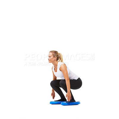Buy stock photo Balance, squat and workout with woman on disk in studio for health, body or exercise. Wellness, challenge and training with female person on white background for flexibility, smile or aerobics