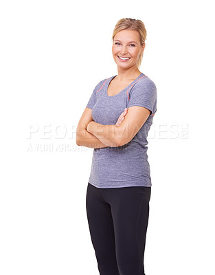 Buy stock photo Studio portrait of a sporty young woman smiling at the camera isolated on white