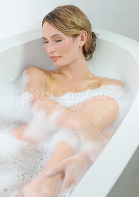 Buy stock photo A beautiful young woman closing her eyes and enjoying a luxurious bath