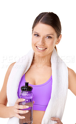 Buy stock photo Studio portrait of a sporty young woman with a towel draped over her shoulders and holding a water bottle isolated on white