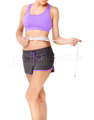 Buy stock photo Woman, stomach and measure tape for fitness, weight loss and health results or training progress in studio. Model check body or abdomen for exercise goals and diet or workout on a white background