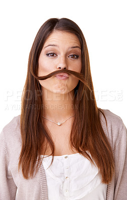 Buy stock photo Funny, woman and portrait with hair as a mustache in studio, white background or model with confidence. Person, pouting and posing with hairstyle, beauty or silly girl with crazy expression or face
