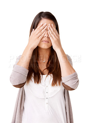 Buy stock photo Casually dressed young woman with her hands covering her eyes