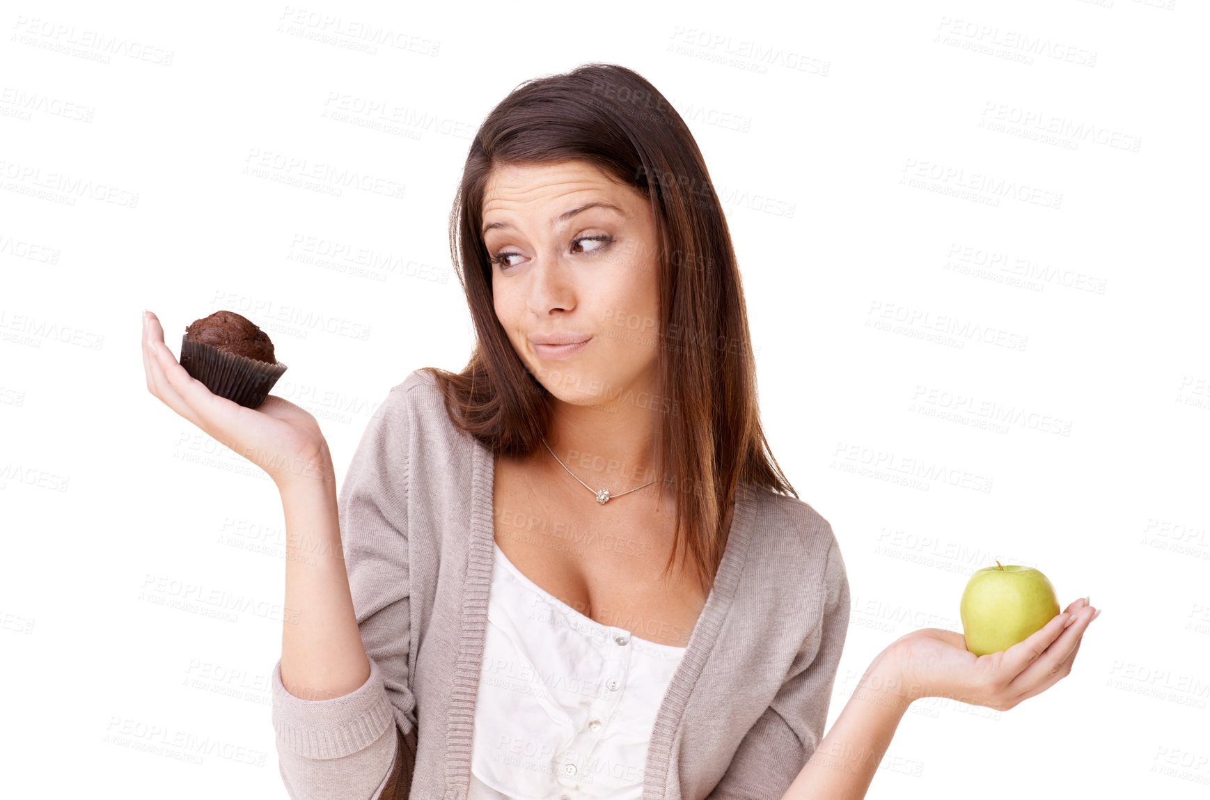 Buy stock photo Doubt, decision and apple or muffin with a woman in studio isolated on a white background for food choice. Unsure, diet or nutrition with a confused young person holding fruit and dessert options