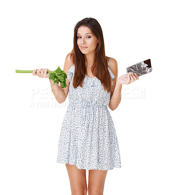 Buy stock photo Doubt, celery and chocolate with woman, portrait and girl isolated on white studio background. Nutrition, person and model with candy, vegan or diet plan with health, wellness and sweet with decision