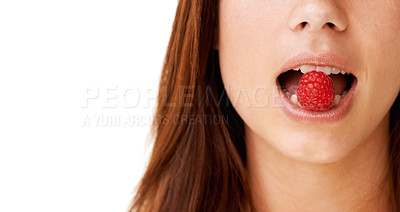 Buy stock photo Health, mouth and closeup of woman with raspberry in a studio for detox, vegan diet and fresh ingredient. Wellness, nutrition and face of young female model with organic fruit by white background.