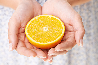 Buy stock photo Health, hands and closeup of woman with orange in studio for detox, vegan diet and fresh ingredient. Wellness, nutrition and zoom of female model with organic fruit or produce for vitamin c benefits.