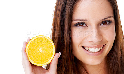 Buy stock photo Portrait of a beautiful brunette woman holding up half of an orange