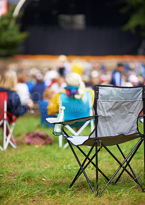 Buy stock photo Outdoor, concert and people with camping chair, festival and blur background with audience. Crowd, outside and seat with party, social event and environment with musical celebration, break and grass