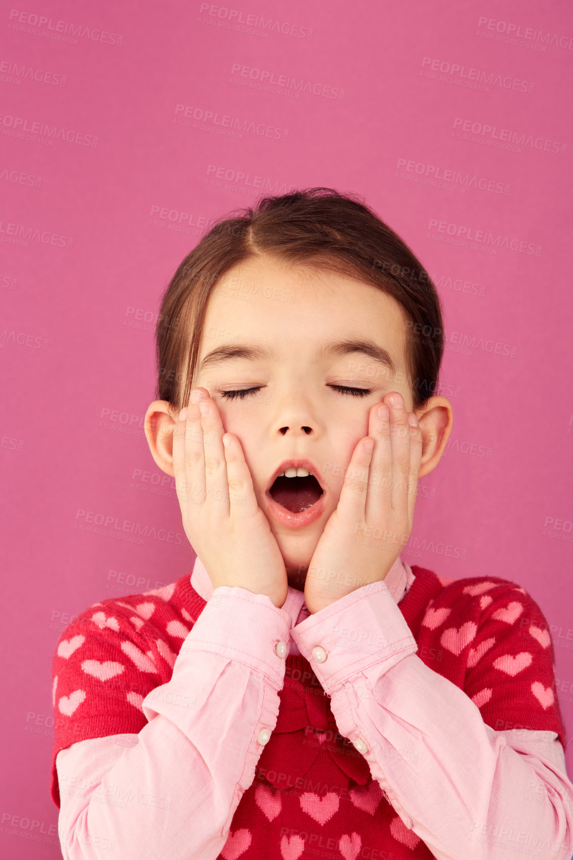 Buy stock photo A cute little girl with her hands on her cheeks and eyes closed in expression of shock