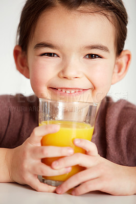 Buy stock photo Happy girl, portrait and glass with orange juice for vitamin C, health and wellness at home. Face of young female person, child or kid smile with fruit beverage or drink for natural nutrition or diet