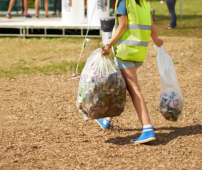 Buy stock photo Woman, cleaning and event outdoor garbage for recycle cans at festival for sustainable eco friendly, nature environment on campground. Female person, plastic bag at social party, helping in forest