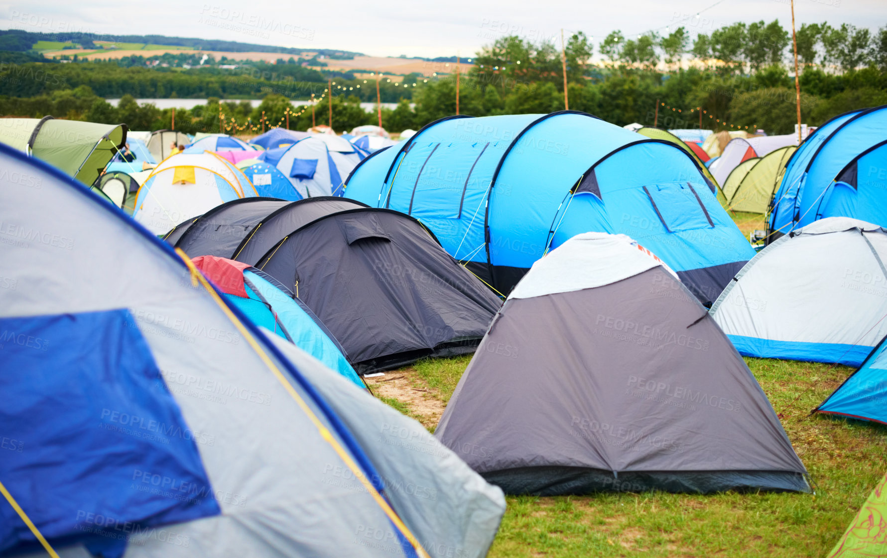 Buy stock photo Tents, field and music festival outdoor for camp event in forest for party celebration, rave weekend on vacation. Shelter, land for crowd concert or dj disco accommodation, park trip in woods nature