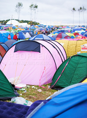 Buy stock photo Tents, campsite and music festival on outdoor field or mess pollution, garbage from party crowd. Shelter, group and entertainment dance gathering event or waste land for holiday, dirt in environment