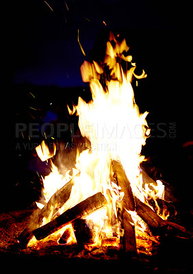 Buy stock photo Campfire, night and wood burning outdoor in nature, forest or countryside. Bonfire flame, firewood or heating, light or glow at evening campsite, hot energy or bright spark in dark woodland fireplace