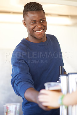 Buy stock photo Smile, party and a black man bartender serving drinks outdoor at an event, festival or celebration. Beer, alcohol and carnival with a happy young person at a bar in a tent for beverage service