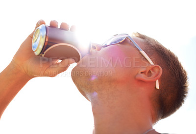 Buy stock photo Man, drinking and beer with sunlight outdoor for concert, event or music festival with sunglasses and lens flare. Person, alcohol and beverage in summer for relax, freedom and enjoyment with sunshine